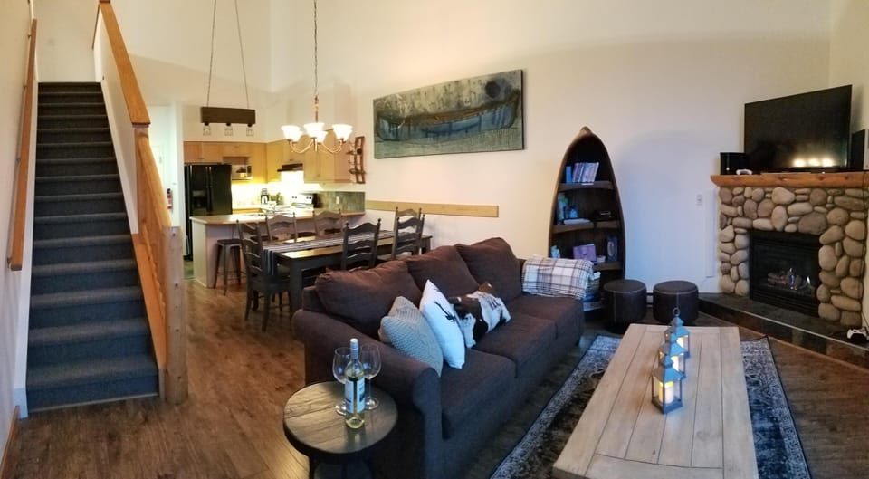 Living area, through dining and kitchen with stairs to loft