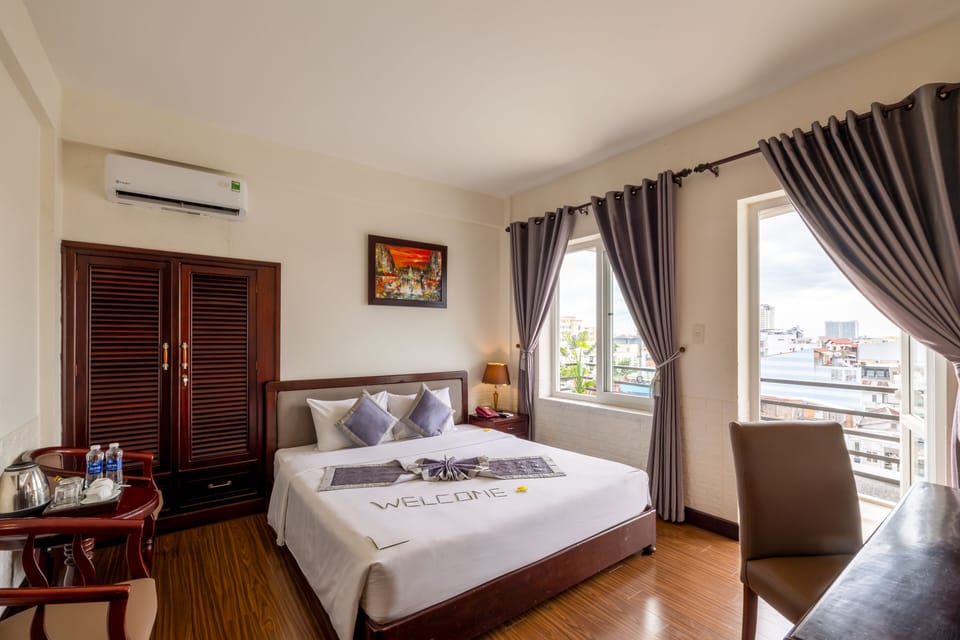 Deluxe Double Room | Minibar, desk, blackout drapes, iron/ironing board