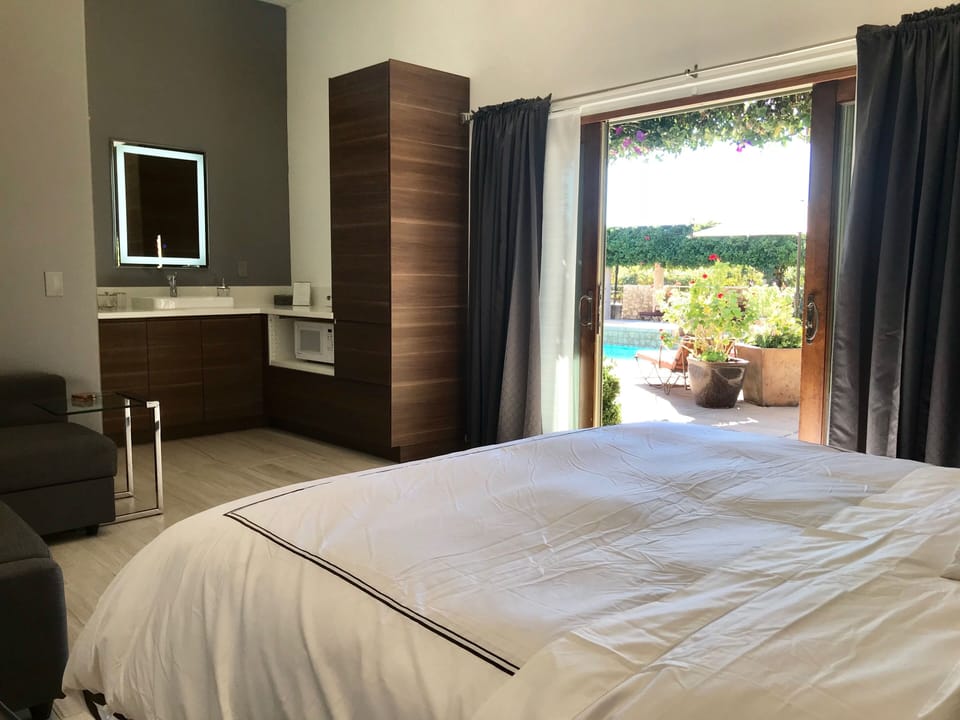 Wake up to pool views from your king-size bed