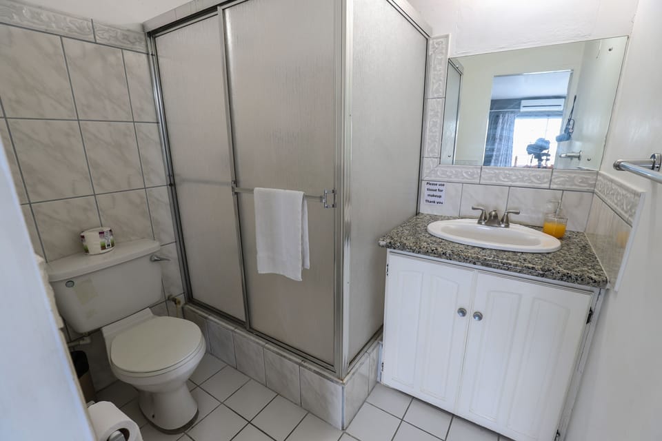 Comfort Quadruple Room, 2 Double Beds, Refrigerator, Garden View | Bathroom | Shower, free toiletries