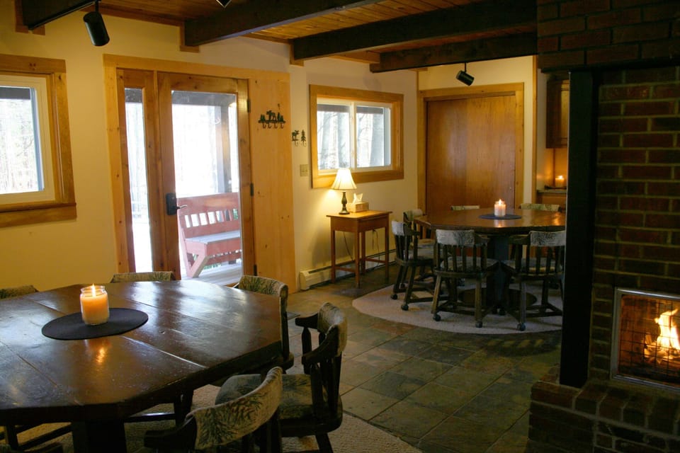 main living level, dining area seats 16, central wood burning fireplace