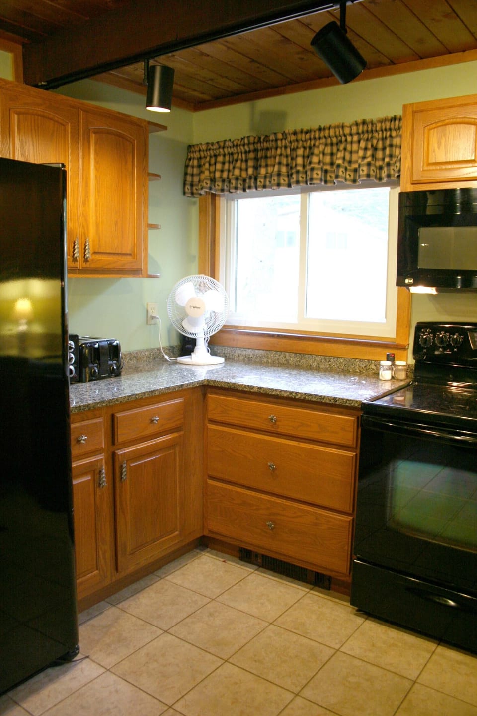 kitchen: side-by-side fridge with filtered ice/water, toaster, toaster oven
