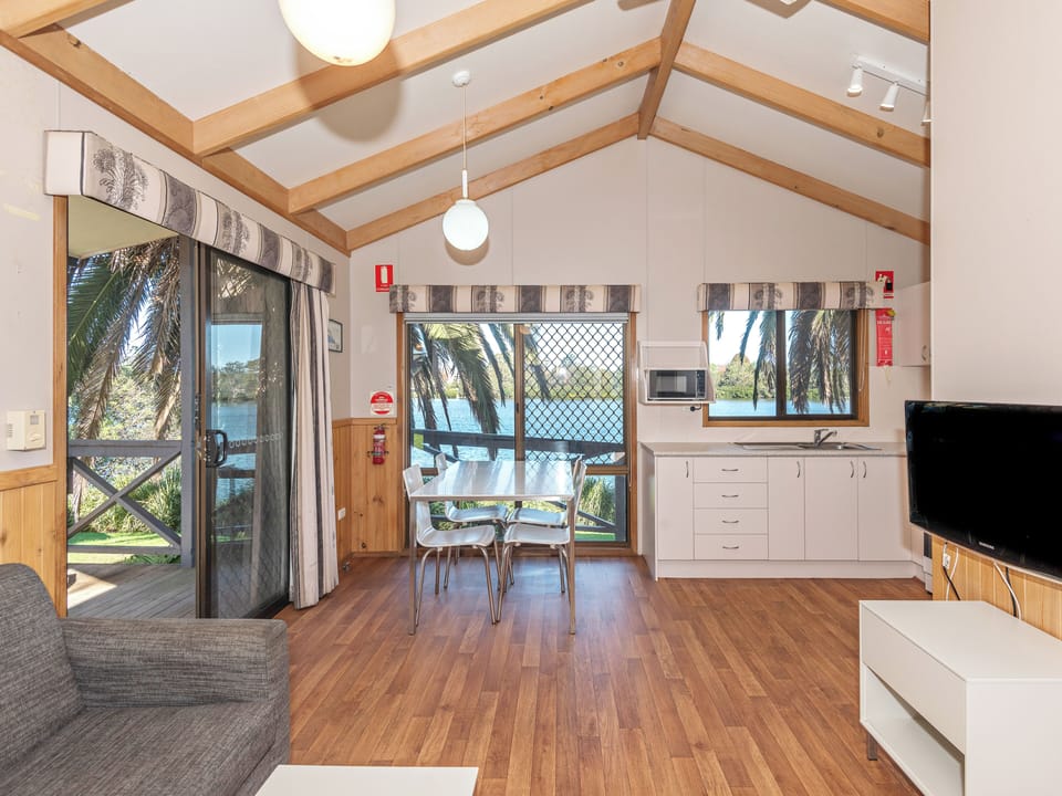 Superior Riverfront 2 Bedroom Cabin - Not Pet Friendly | Living area | Flat-screen TV