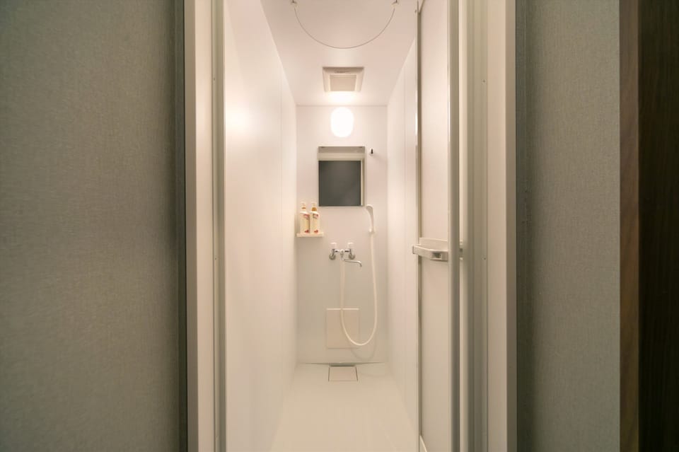 Shower, free toiletries, hair dryer, slippers