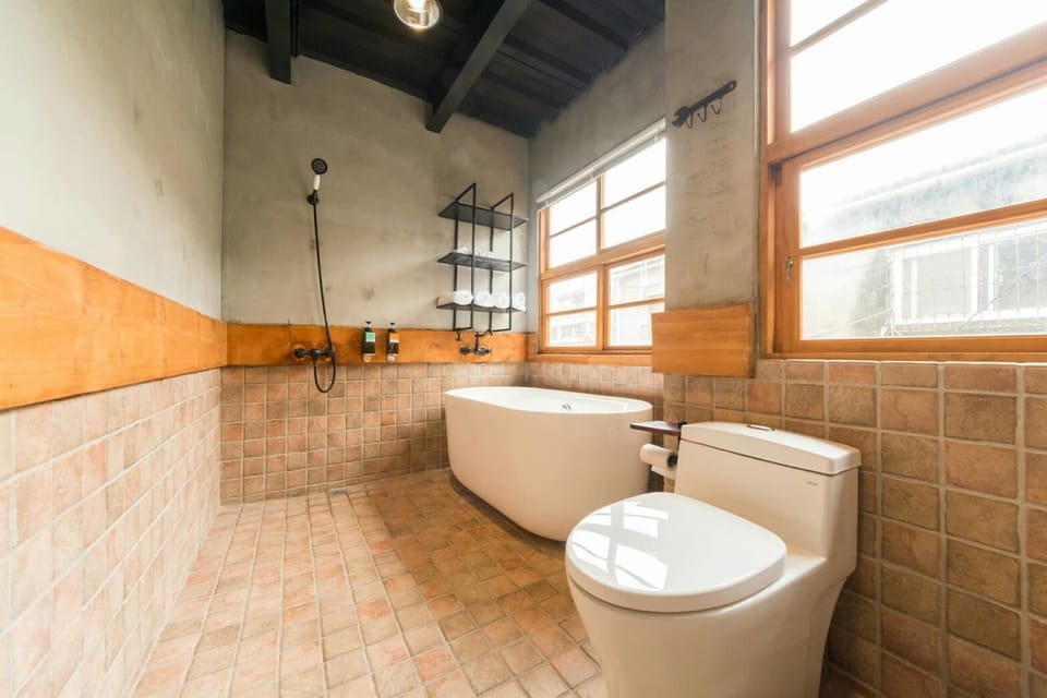 Signature Loft, Multiple Beds, Non Smoking | Bathroom | Separate tub and shower, deep soaking tub, rainfall showerhead