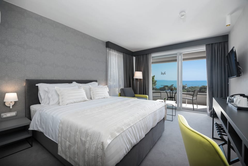 Standard Double Room, Sea View | Minibar, in-room safe, desk, laptop workspace