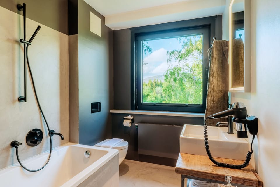Family Suite, 2 Bedrooms | Bathroom | Hair dryer, towels, soap, shampoo