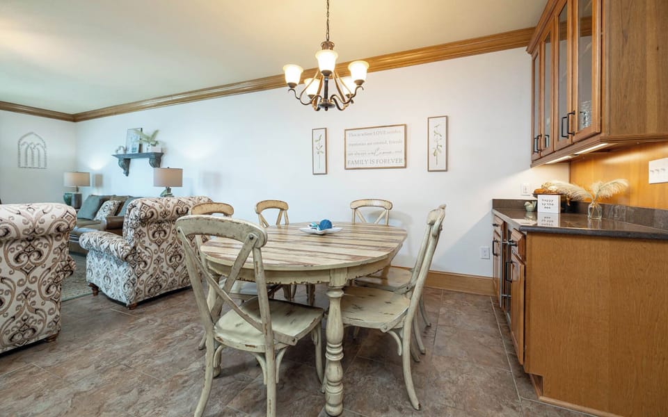 Gather around the dining table, surrounded by charming decor and inviting seating for memorable meals together