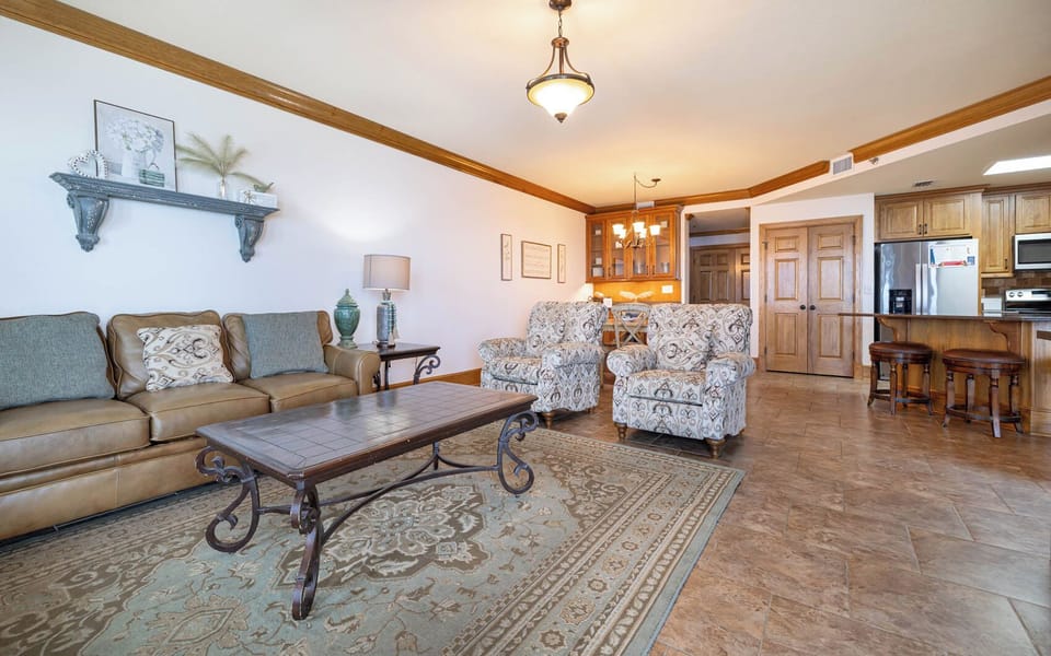 Unwind in the inviting living area, featuring a sofa with queen sleeper, perfect for relaxing after a day of fun