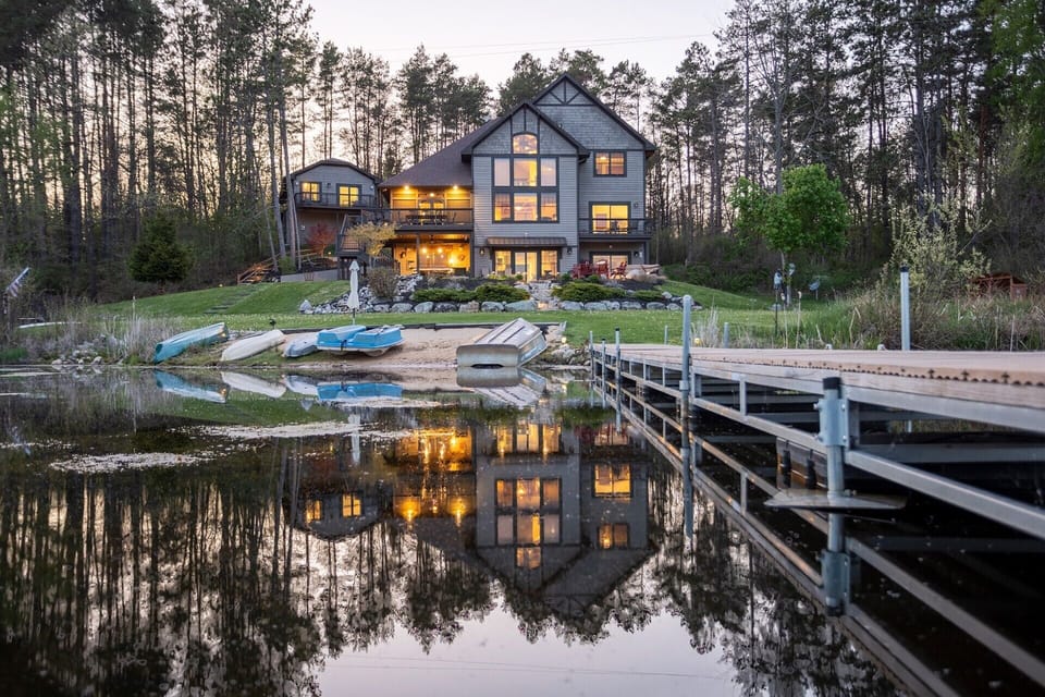 From the Dock: Easy on the eye from the dock soaking up dusk, the beach, complimentary boats and the incredible Lodge.  A lot of fish have been caught off this dock!