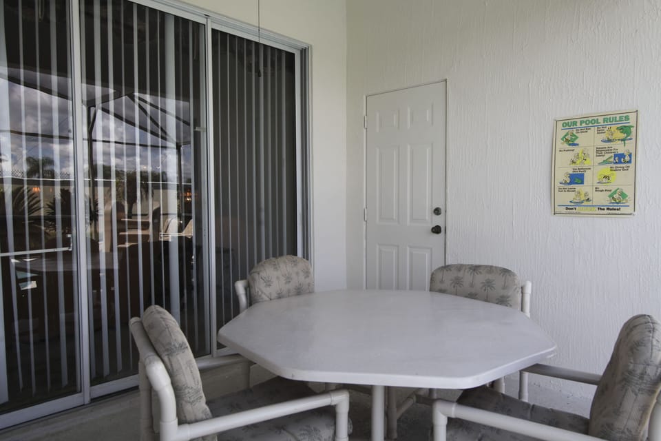Out side patio table near pool 