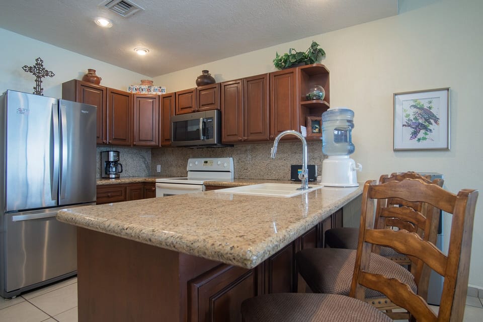 counter top at the kitchen with bar stools