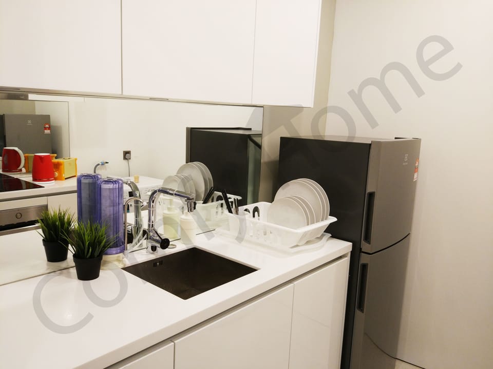 Kitchenette that comes with fridge and water filter.