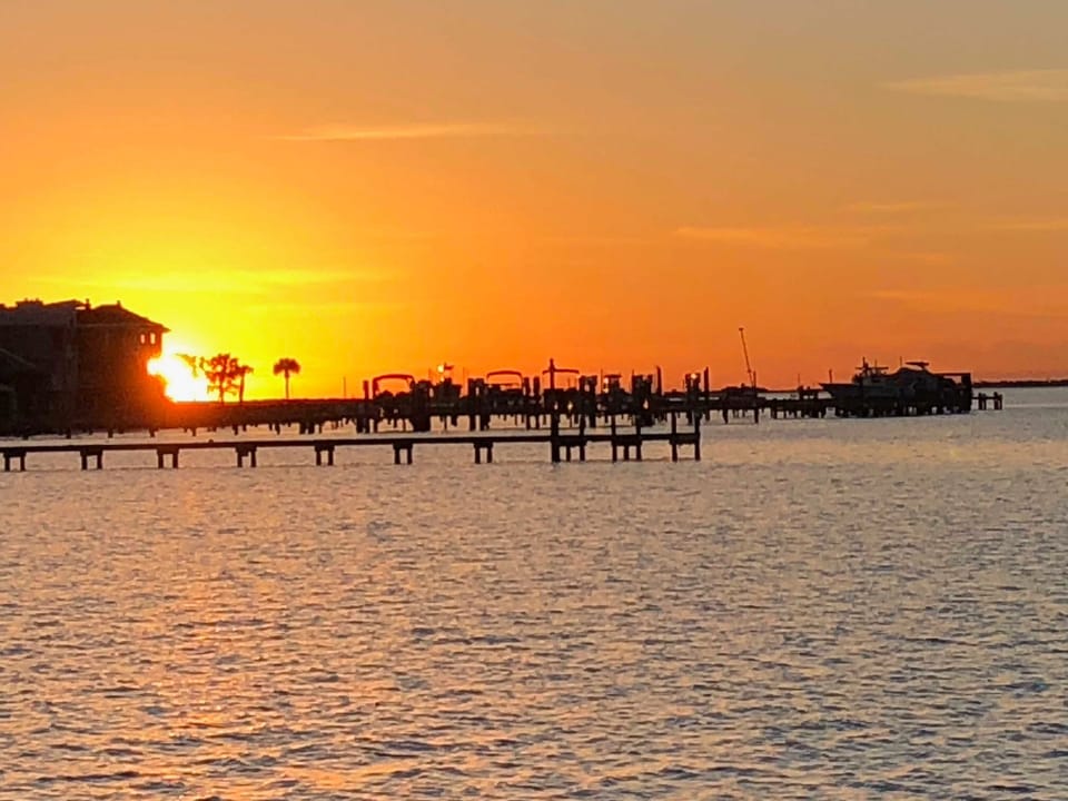Sunset from the Boardwalk private pier, a daily favorite.