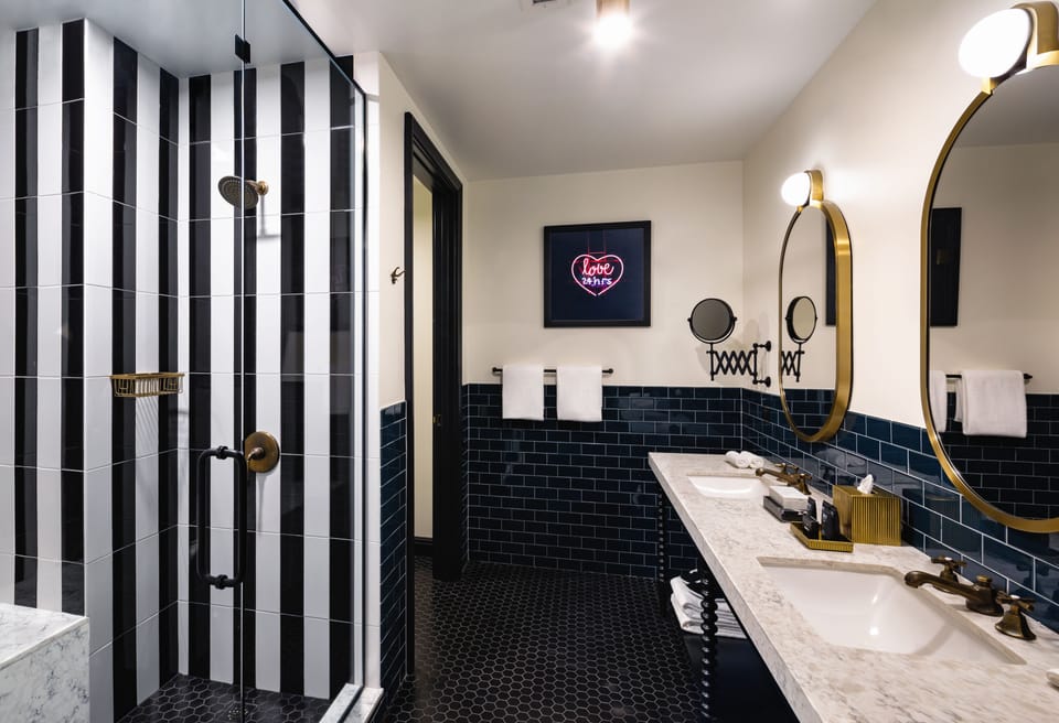 Shower, rainfall showerhead, designer toiletries, hair dryer