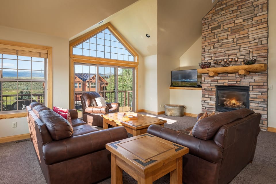 Main living area with gas fireplace, smart/Direct TV and plenty of seating