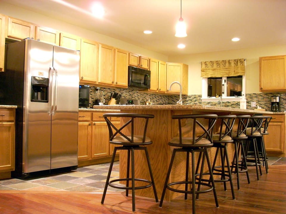 kitchen, bar seating for 8, fridge w/ice/water, wine fridge, gas stove, 2 sinks