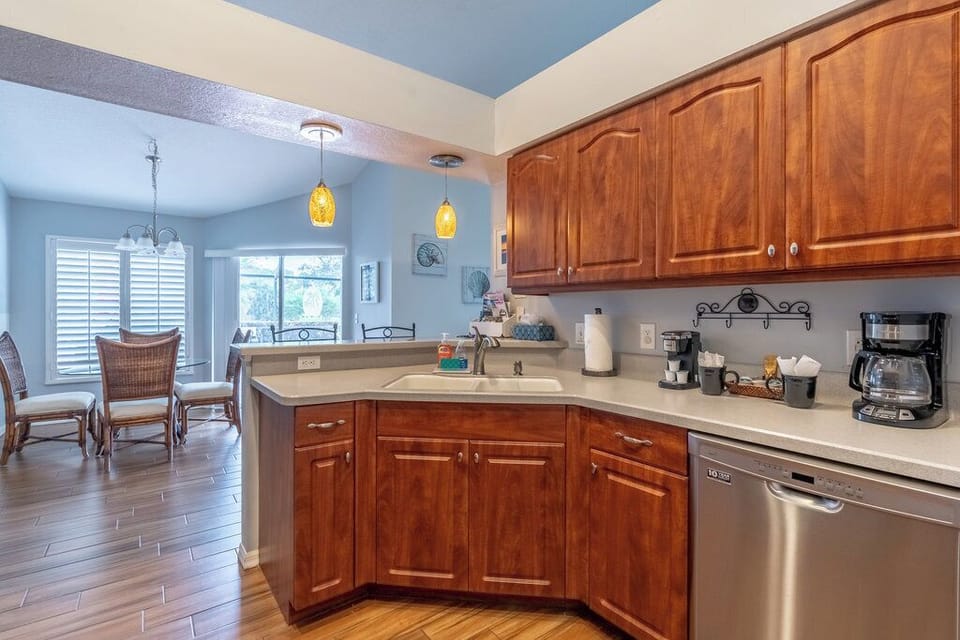 Fully stocked family sized kitchen with coffee maker.