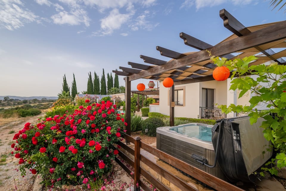 Unobstructed views from the garden and the hot tub. Enjoy the privacy and tranquility surrounded by vibrant flowers.