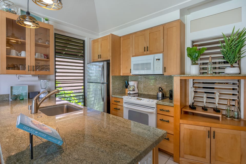 The kitchen. All new appliances.  Hawaiian cookbooks. 