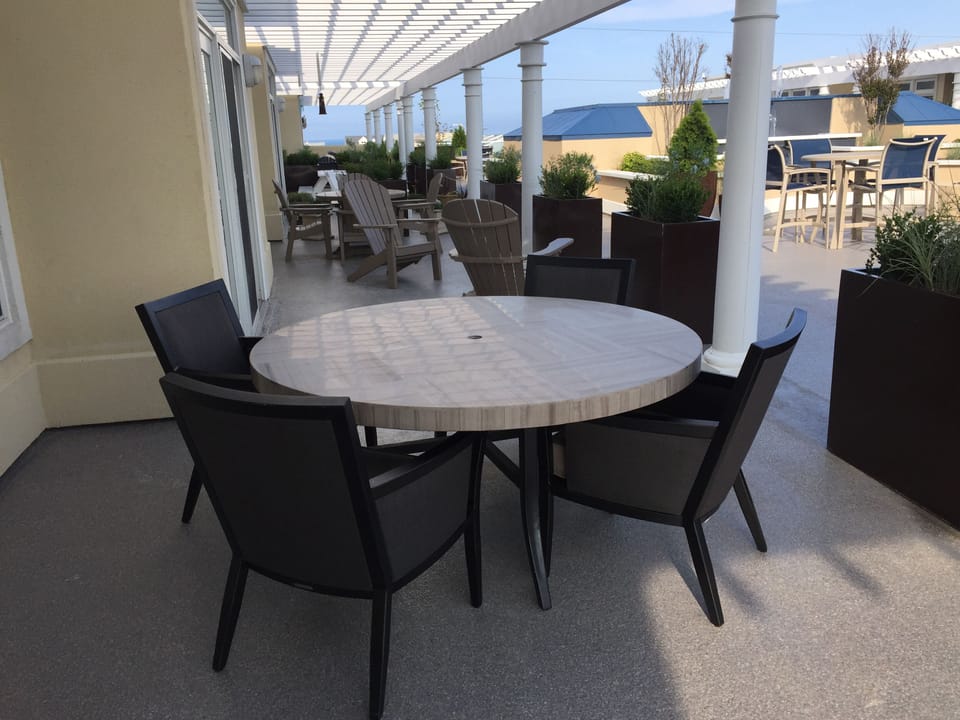 Outdoor eating area (private terrace) located on shared plaza