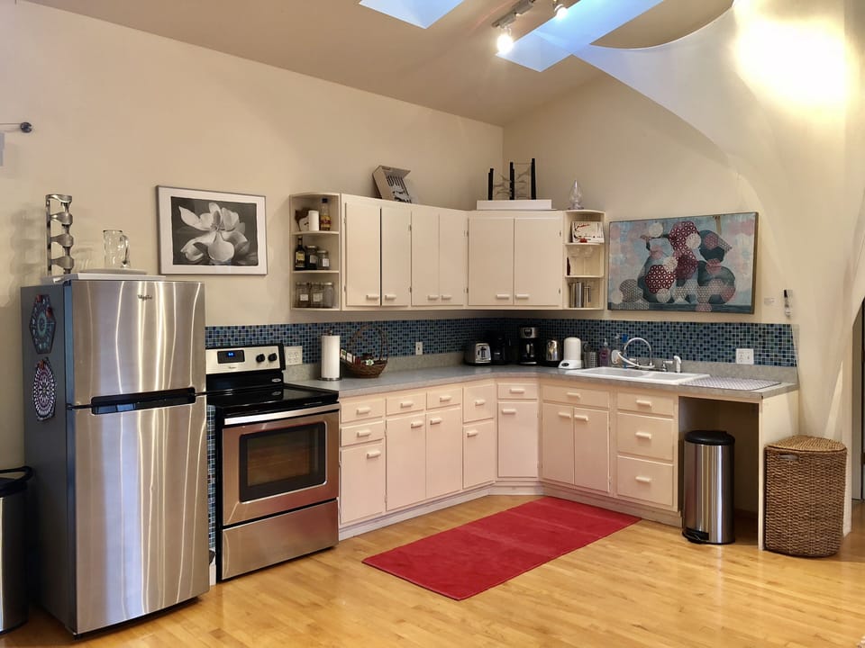 Here you see the fridge and stove in the kitchen 