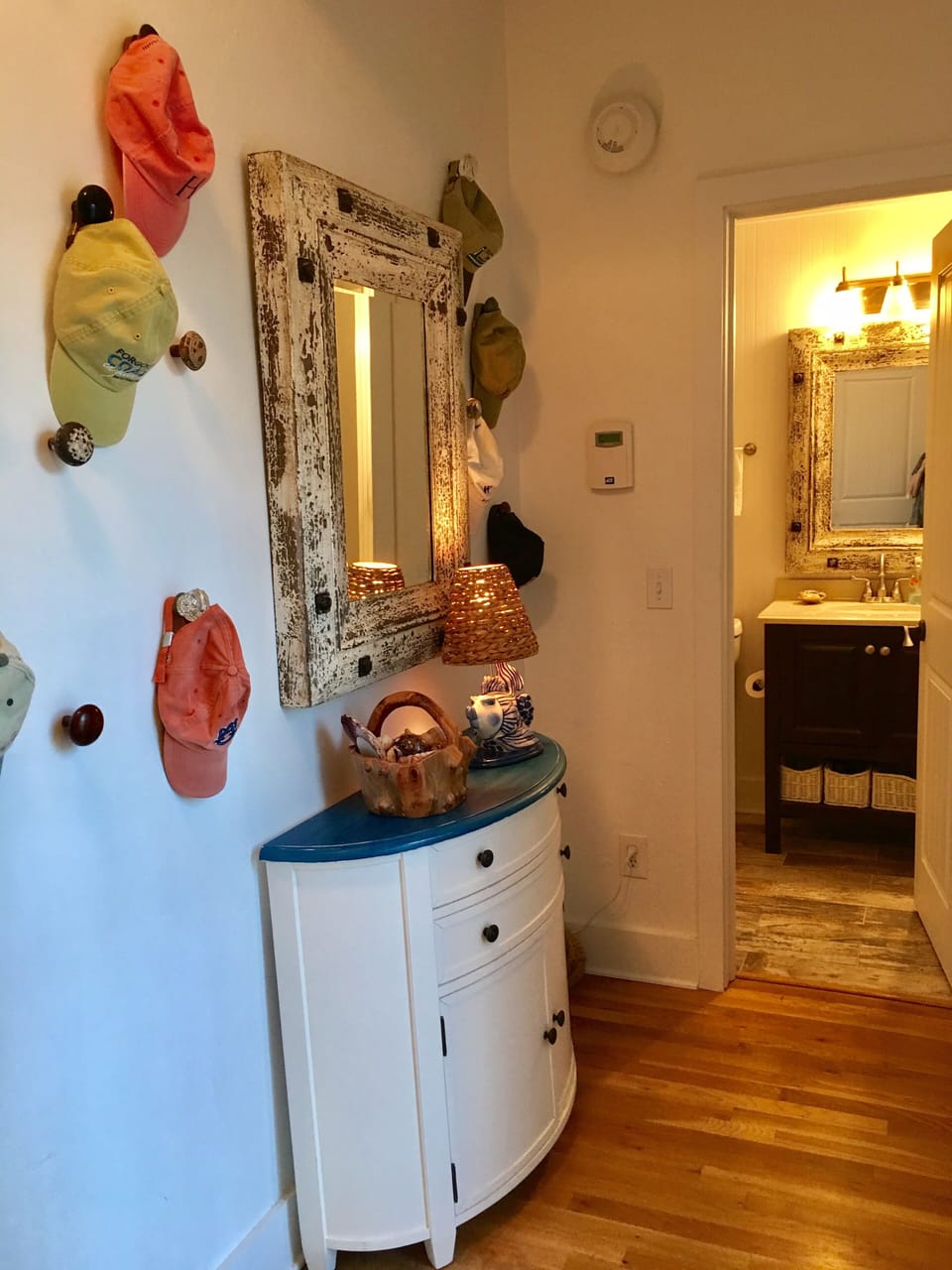Charming back entryway and second bathroom with bathtub.