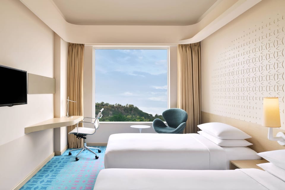 Premium bedding, down comforters, minibar, in-room safe