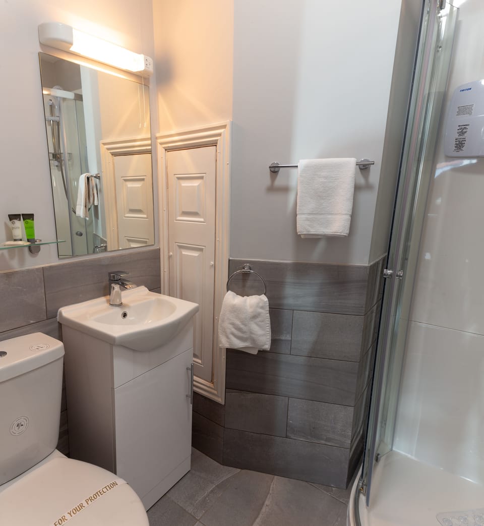 Hair dryer, towels, soap, shampoo