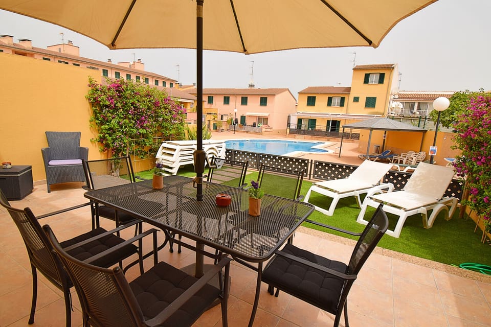 terrace with garden next to the swimming pool