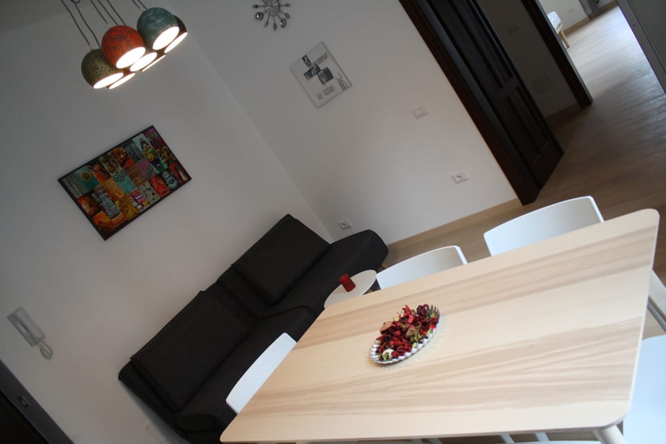 Deluxe Apartment, 1 Bedroom, Balcony, City View | Living area | Flat-screen TV