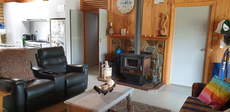 lounge room with slow combustion heater