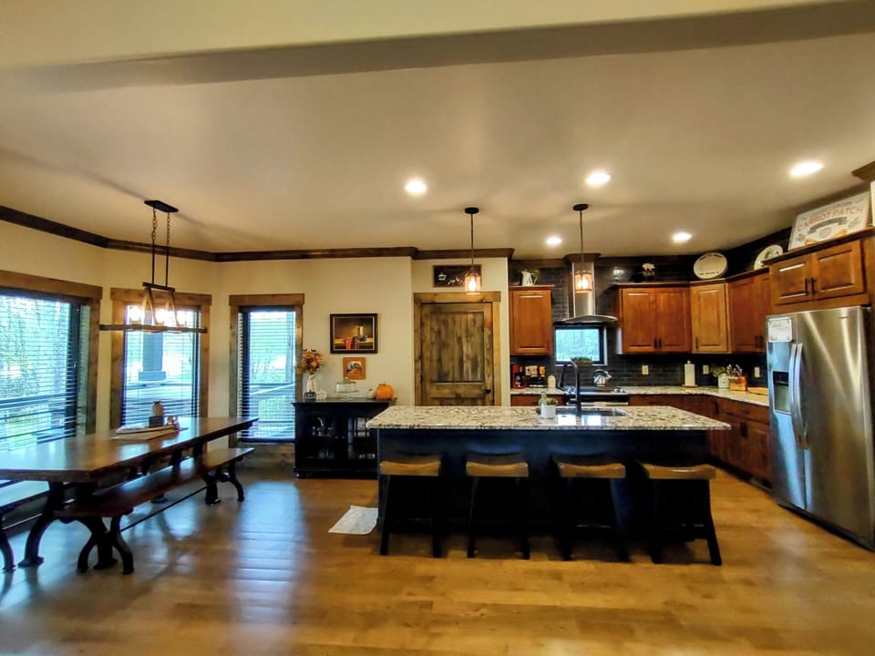 View of kitchen and dining table from living room.