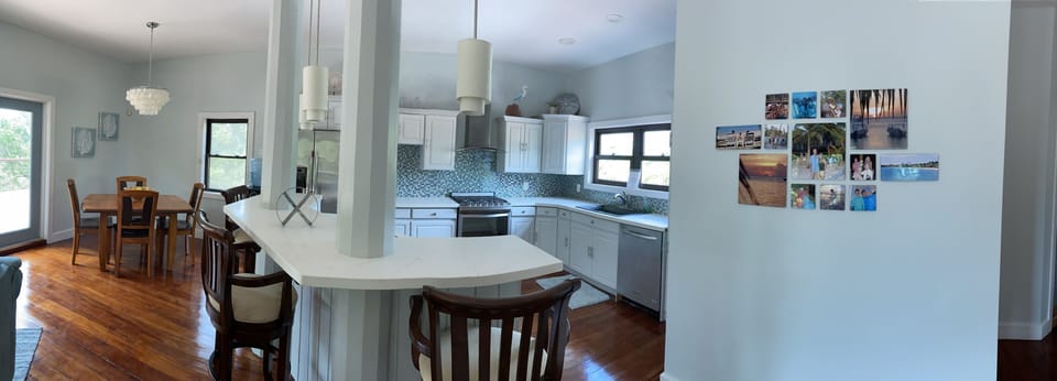 Newly renovated kitchen: quartz counters, island, 2 sinks, modern appliances