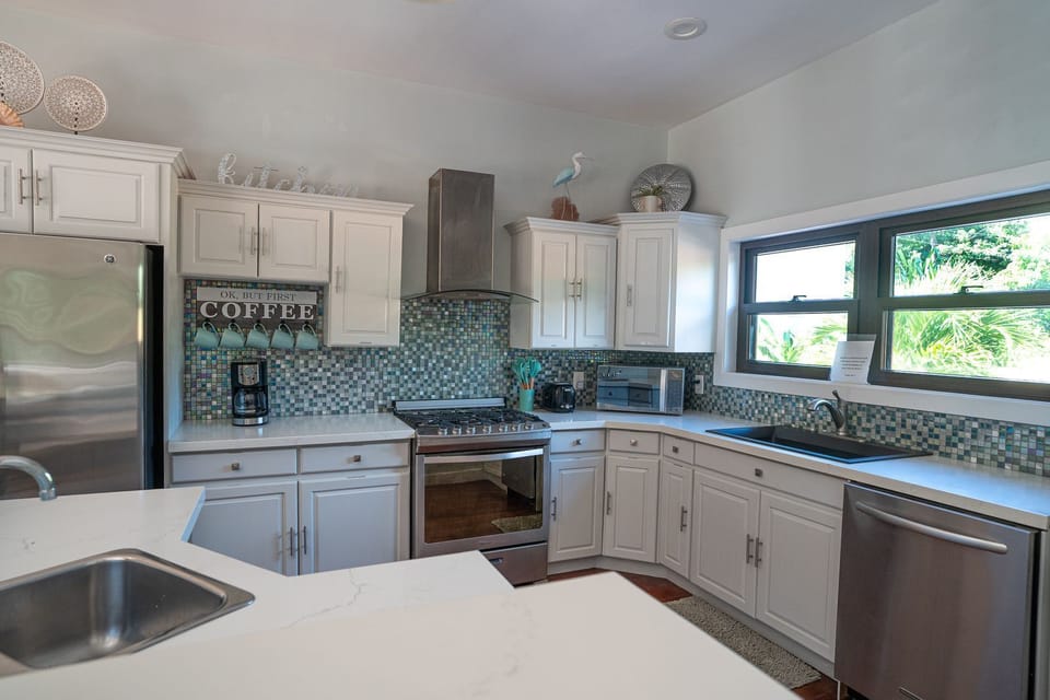 Bright, modern kitchen with 2 sinks, gas stove, dishwasher and room to move!  