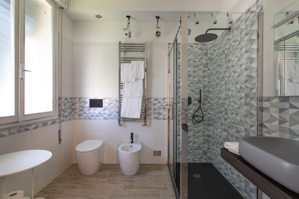 Deluxe Double Room | Bathroom | Hair dryer, slippers, towels