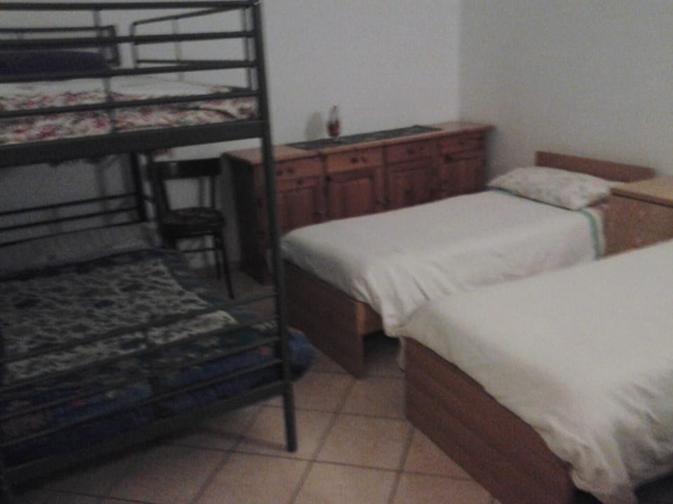 Desk, iron/ironing board, bed sheets