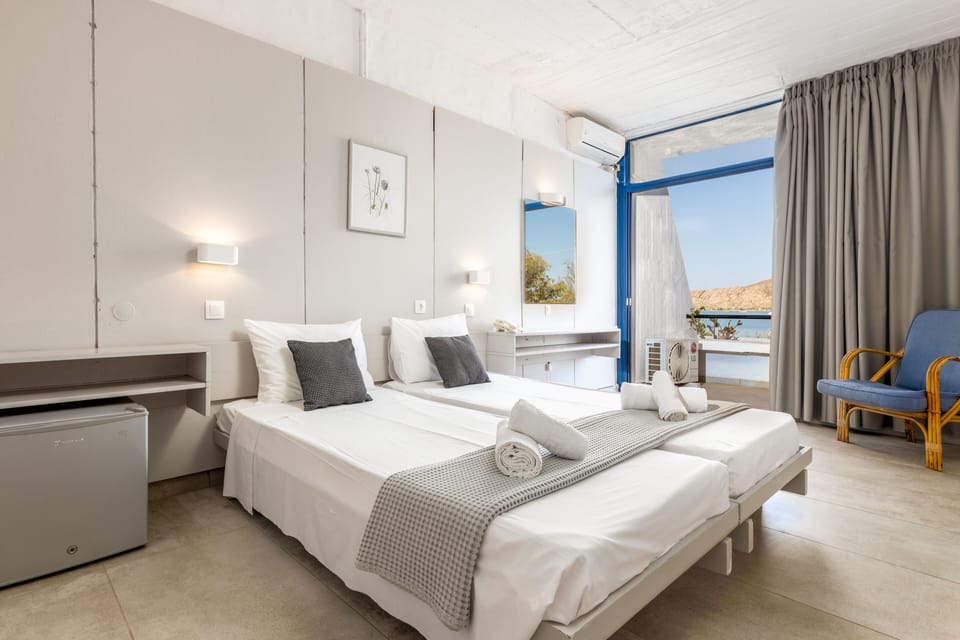 Family Room, Sea View | Minibar, in-room safe, desk, blackout drapes