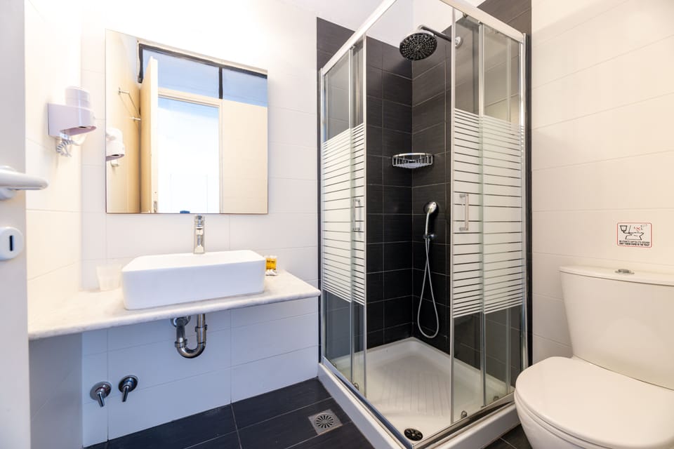 Family Room, Sea View | Bathroom | Shower, hair dryer (on request), towels