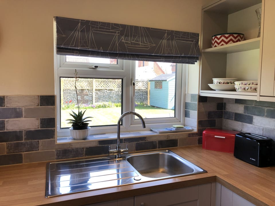 Kitchen - looking through the window into the back garden