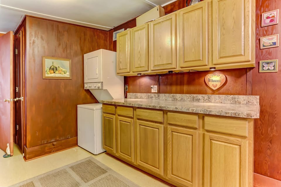 Kitchen area with washer and dryer.