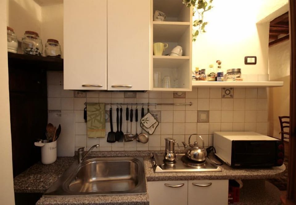 Front view of kitchenette, 2 elctric burners, counter top oven,fridge freezer