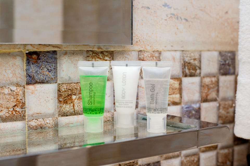 Shower, rainfall showerhead, eco-friendly toiletries, slippers