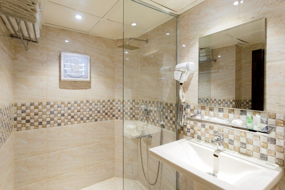 Shower, rainfall showerhead, eco-friendly toiletries, slippers