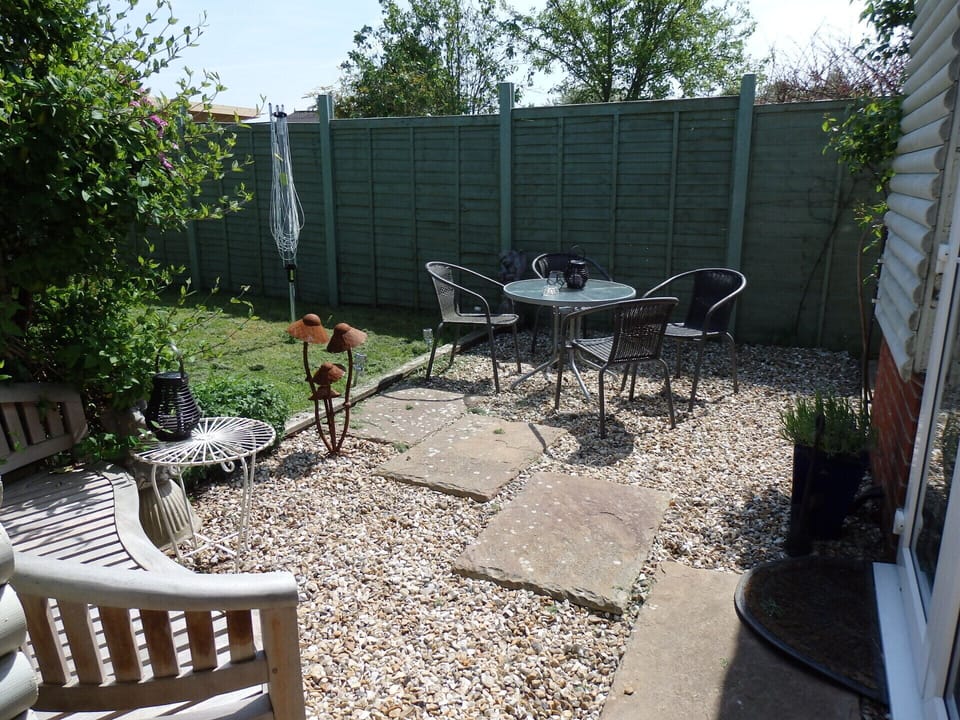 Private, enclosed garden with patio