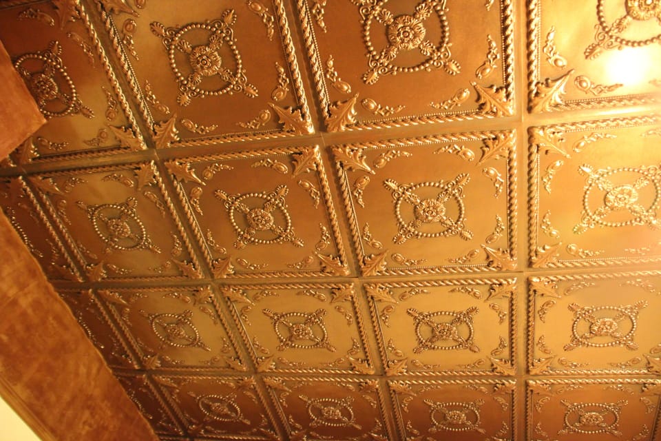 The ornate ceiling in the den. 