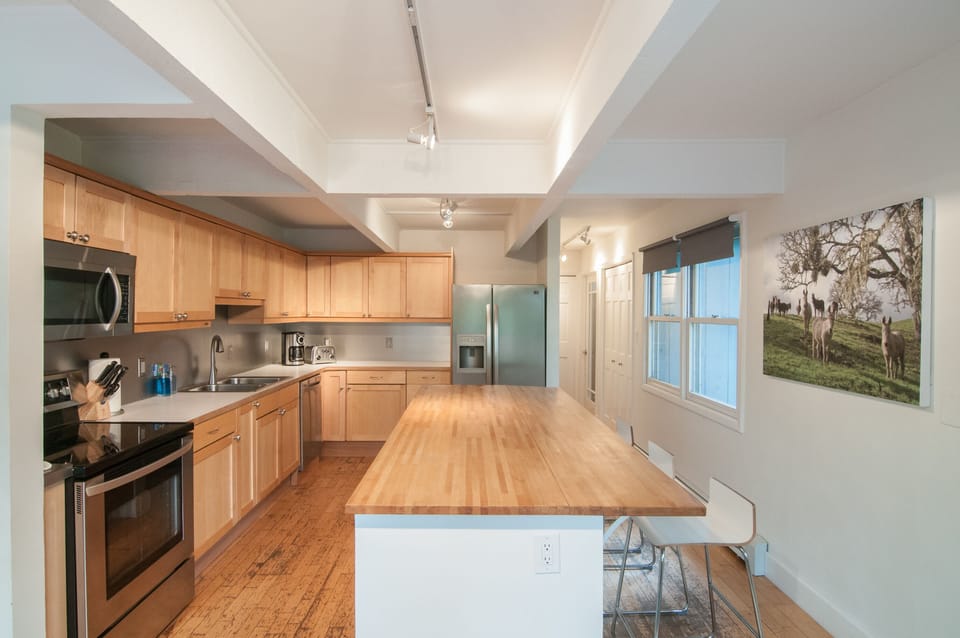 Cook's kitchen with small appliances & assorted cooking tools 