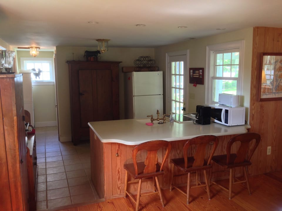 Kitchen area from Family room with door to rear porch