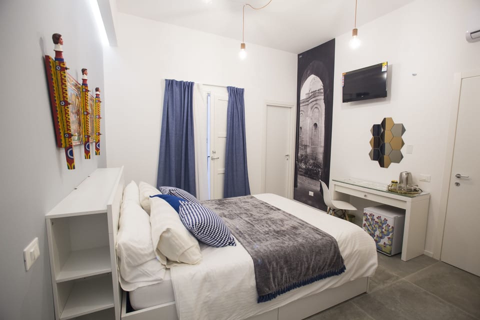Deluxe Double Room, Courtyard View | In-room safe, desk, soundproofing, iron/ironing board