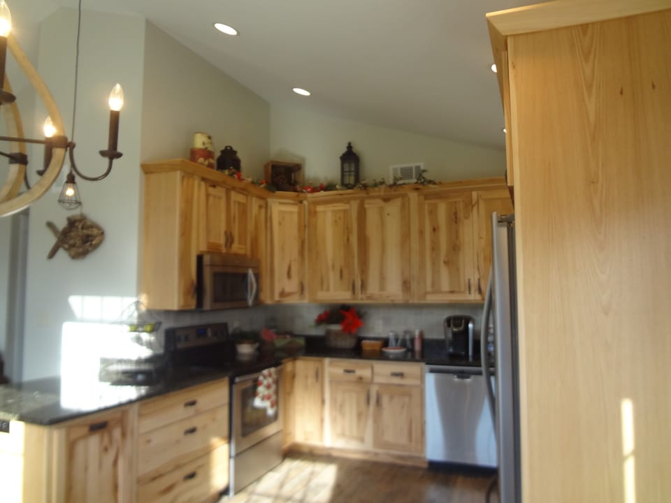 kitchen, stainless appliances, granite counters high ceilings.